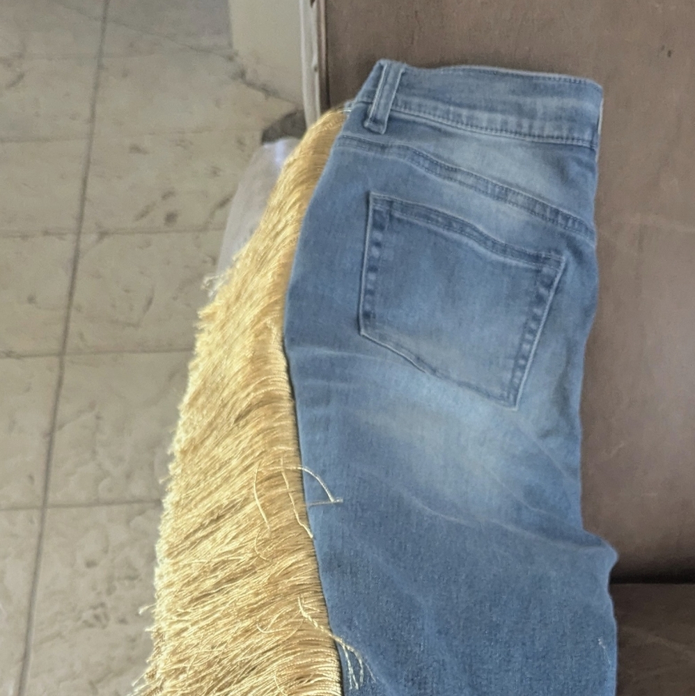 COWGIRL JEANS WITH TAN FRINGES IN A SIZE 6
